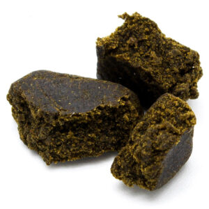 Traditional Afghan Black Hash concentrate with dark exterior texture and resin-rich appearance.