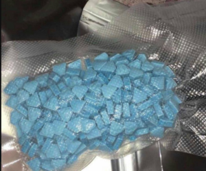 Tablet featuring a Punisher-style logo, commonly referred to as a 'Punisher' pill in illicit drug markets. mdma for sale