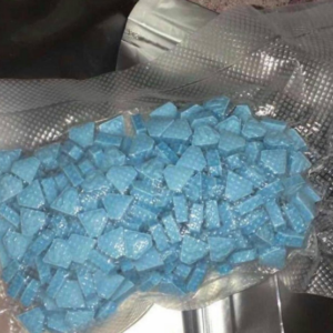 Tablet featuring a Punisher-style logo, commonly referred to as a 'Punisher' pill in illicit drug markets. mdma for sale
